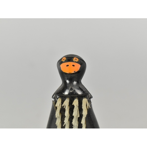 31 - A Mid 20th Century novelty plastic nail brush in the form a Penguin, Made in Hong Kong, 11cm high
