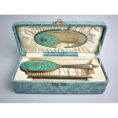 20 - A Faux Shagreen Box Containing Enamelled Hairbrush and Matching Comb with Oval Mirror Housed Under H... 