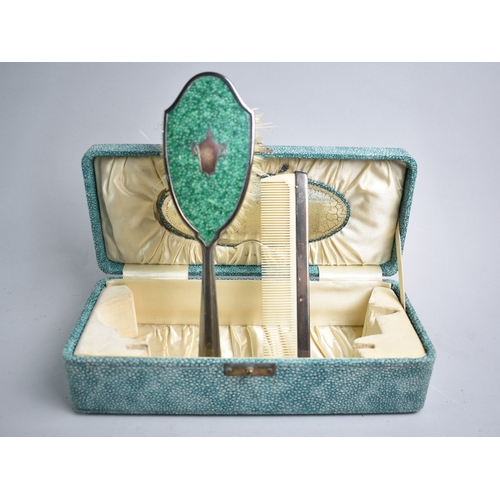 20 - A Faux Shagreen Box Containing Enamelled Hairbrush and Matching Comb with Oval Mirror Housed Under H... 