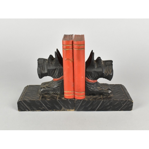 27 - A Pair of Early/Mid 20th Century Carved and Painted Wooden Bookends with Scotty Dog and Book Mounts,... 