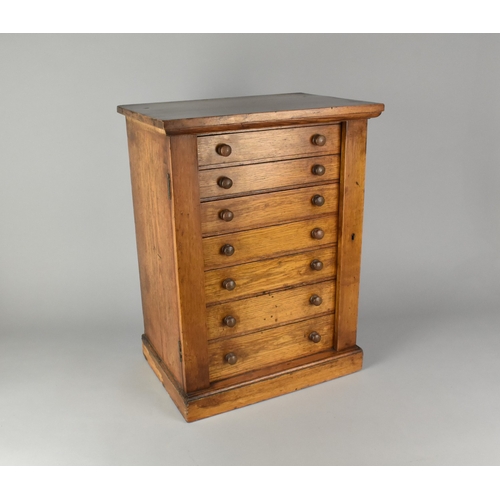 39 - An Edwardian Oak Seven Drawer Collectors Chest, Some Loss of Veneer to Left Side, 38cms Wide by 26cm... 