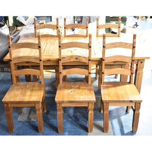 A Modern Rectangular Pine Kitchen Table with Six Ladder Back Chairs