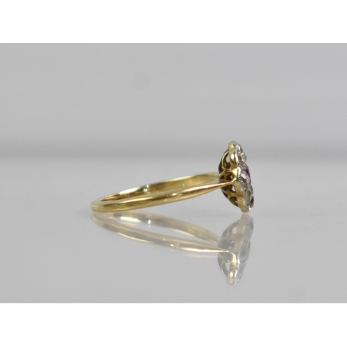 24 - An 18ct Gold, Platinum, Ruby and Diamond Daisy Ring, Old European Cut Ruby Measuring 3.1mm by 3.5mm ... 