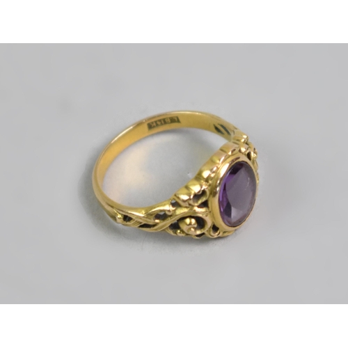 25 - An 14ct Gold and Amethyst Dress Ring, Oval Low Cabochon Stone, (Verso Faceted), Measuring 8.9x6.8mm.... 
