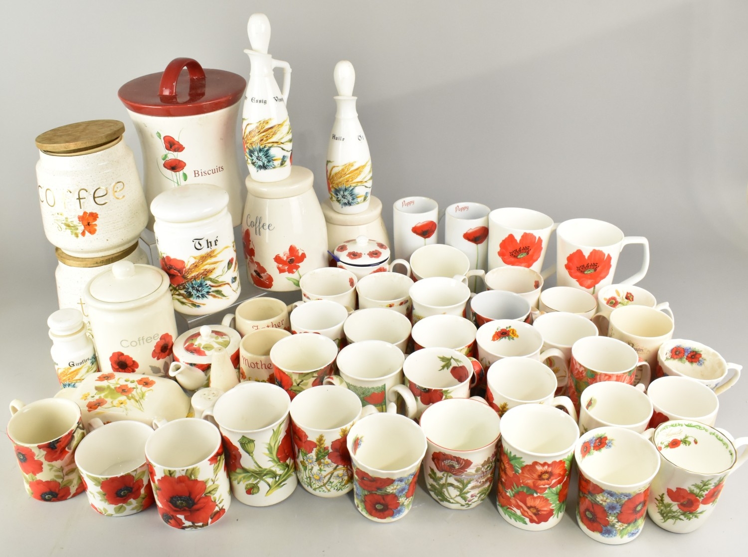 A Collection of Various Poppy Pattern Ceramics to Comprise Mugs ...