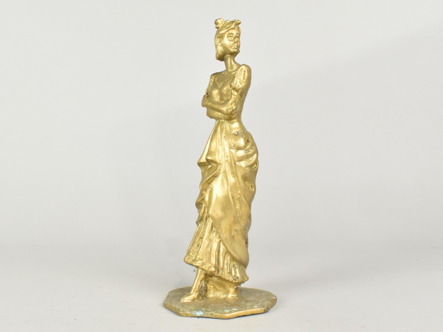 A Cast Brass Figure of an Edwardian Lady, 22cms High