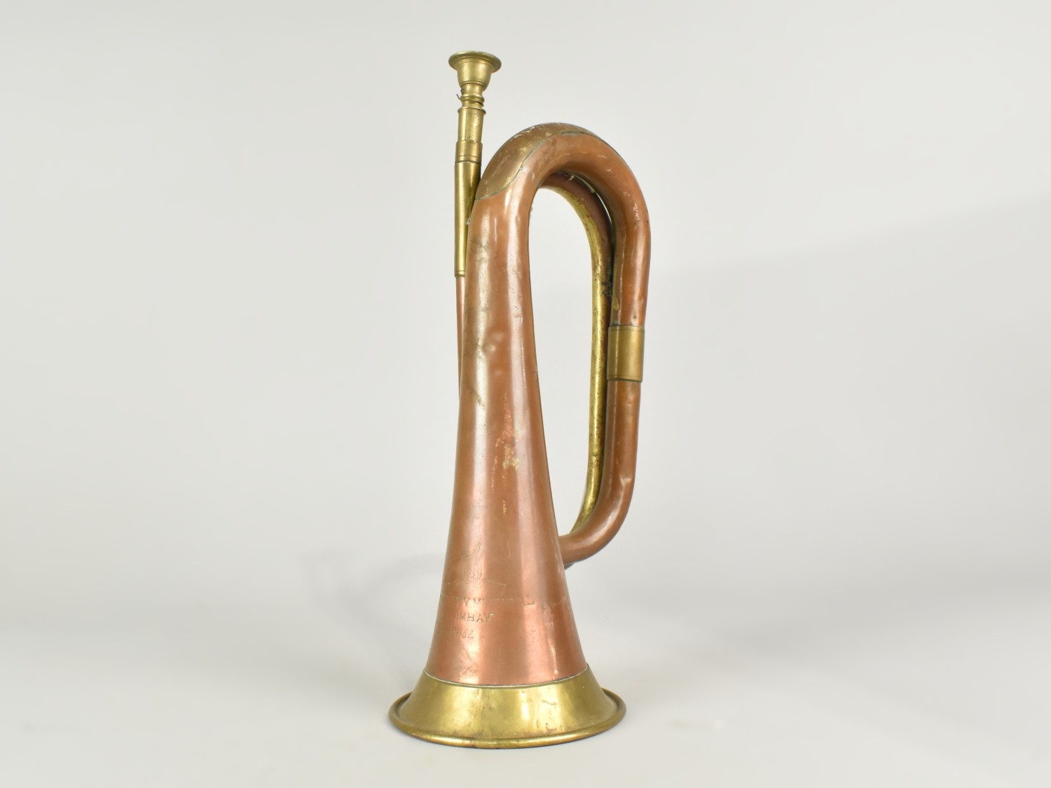 A Copper and Brass Military Bugle Inscribed 'Variety Musical Bombay 1932'