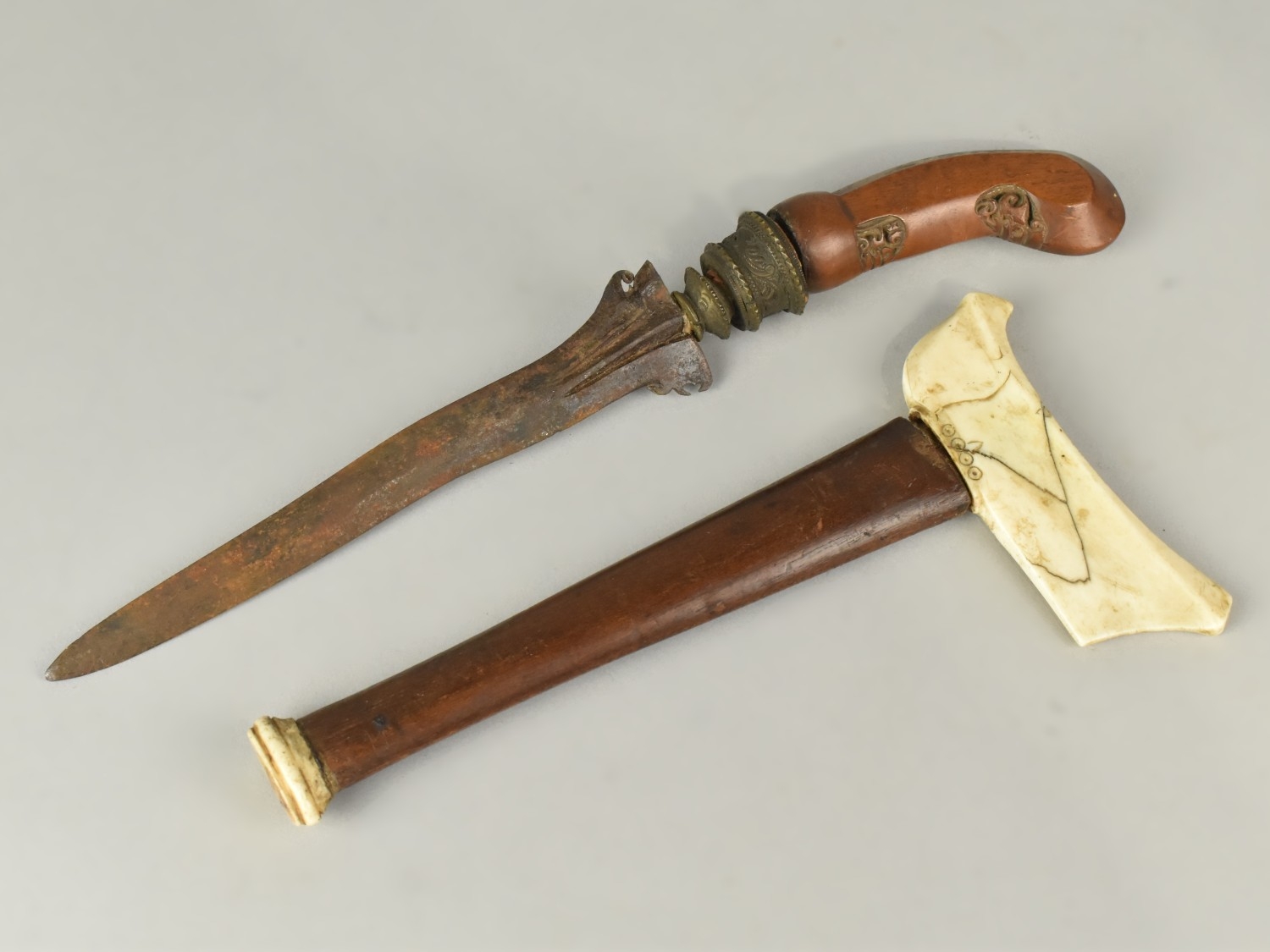 A Far Eastern Kris Dagger with Rib Bone Guard and Carved Wooden Handle ...