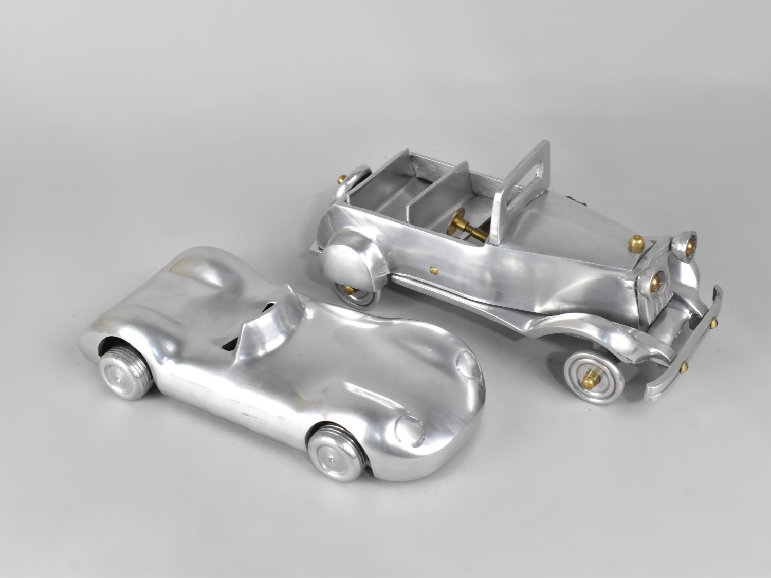 Two Late 20th Century Brushed Aluminium Models of Racing Car and Pickup ...