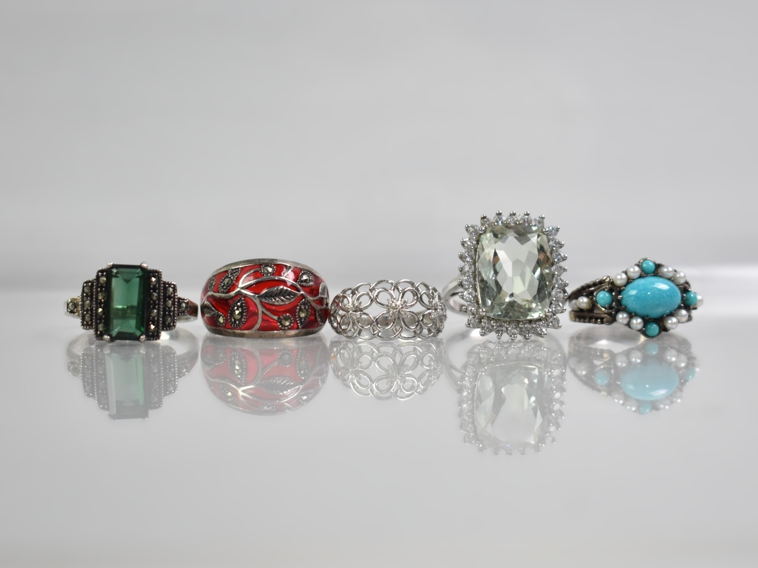 A Collection of Five Silver Jewelled Rings to Comprise Red Enamel and ...