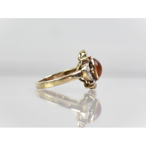 18 - A Diamond, Amber and 9ct Gold Mounted Dress Ring, Oval Cabochon Amber Stone Measuring 7.6mm by 5.7mm... 