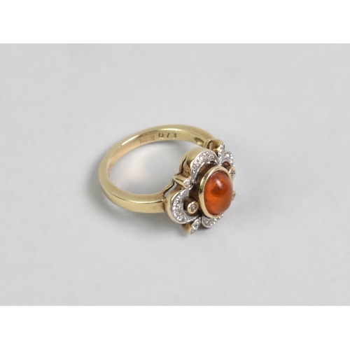 18 - A Diamond, Amber and 9ct Gold Mounted Dress Ring, Oval Cabochon Amber Stone Measuring 7.6mm by 5.7mm... 