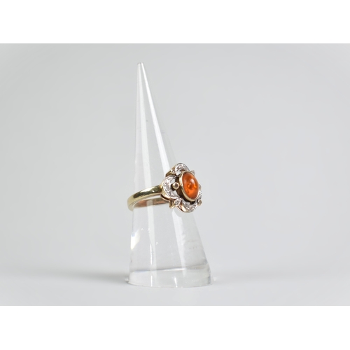 18 - A Diamond, Amber and 9ct Gold Mounted Dress Ring, Oval Cabochon Amber Stone Measuring 7.6mm by 5.7mm... 
