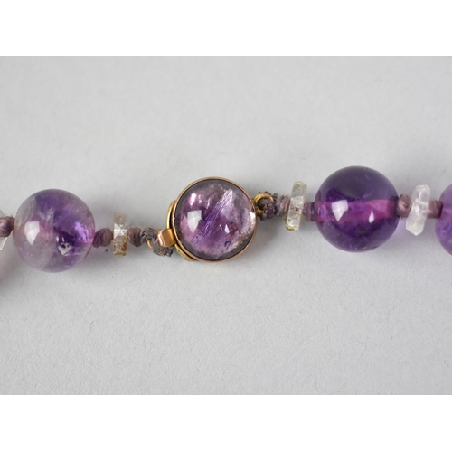 3 - A Late 19th/Early 20th Century String of Spherical Amethyst Beads with a 9ct Gold Clasp, Beads Appro... 