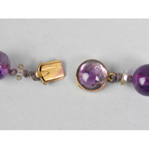3 - A Late 19th/Early 20th Century String of Spherical Amethyst Beads with a 9ct Gold Clasp, Beads Appro... 