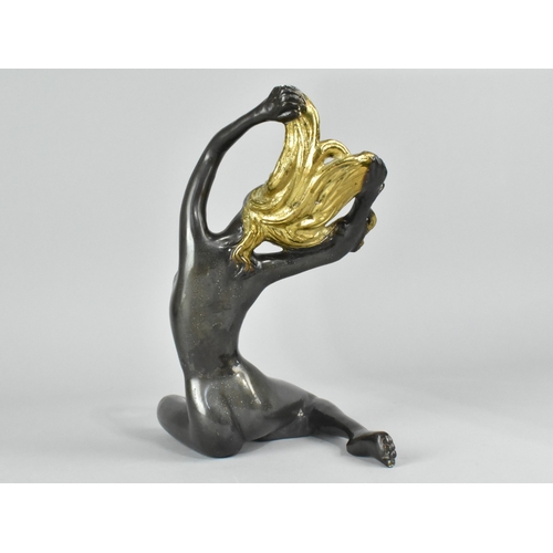 26 - A Patinated and Gilded Bronze Study of a Seated Nude, 25cms High