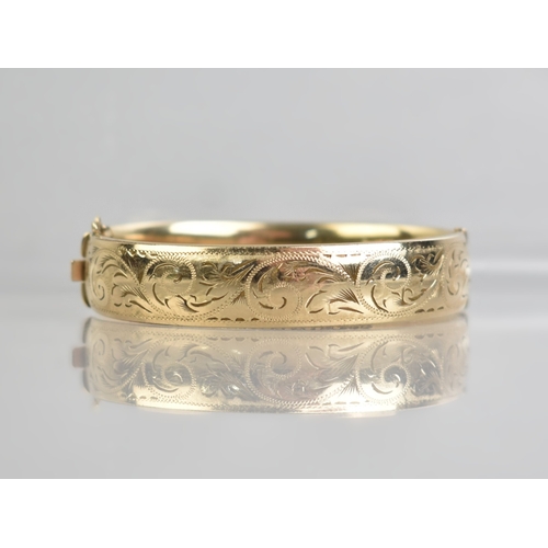 A Vintage Hinged Bangle, Engraved Scrolling Design to Front Panel ...