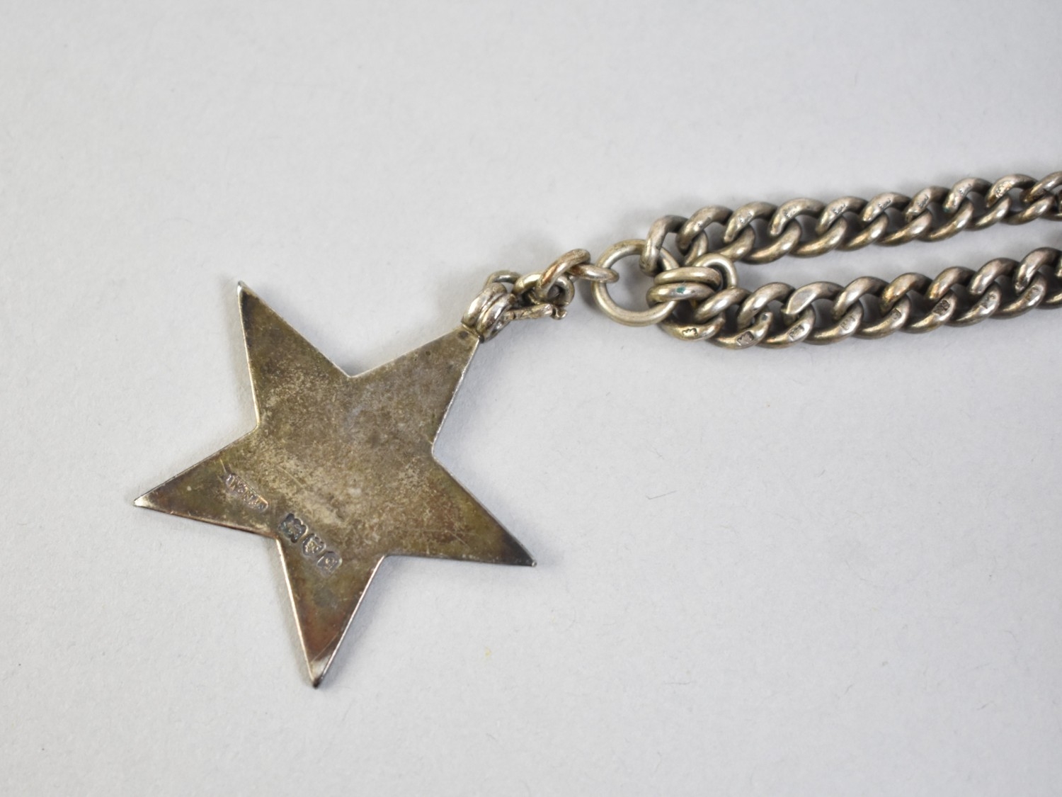 A Silver Albert Chain with Silver Star Shaped Fob, Graduated Curb Link ...
