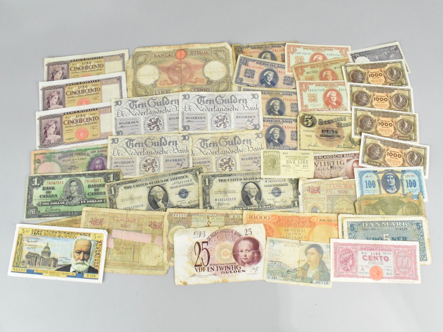 A Collection of Foreign Bank Notes to Include Canada, France, Greece ...