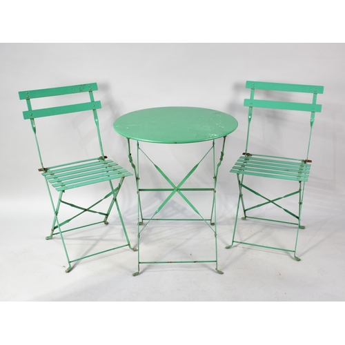 555 - A Mid 20th Century Green Painted Metal Folding Patio Table and Chair Set, Table 59cms Diameter