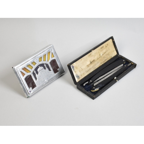 An Indian WWII Trench Art Cigarette Case Decorated with the Taj Mahal  together with a Cased Pair of