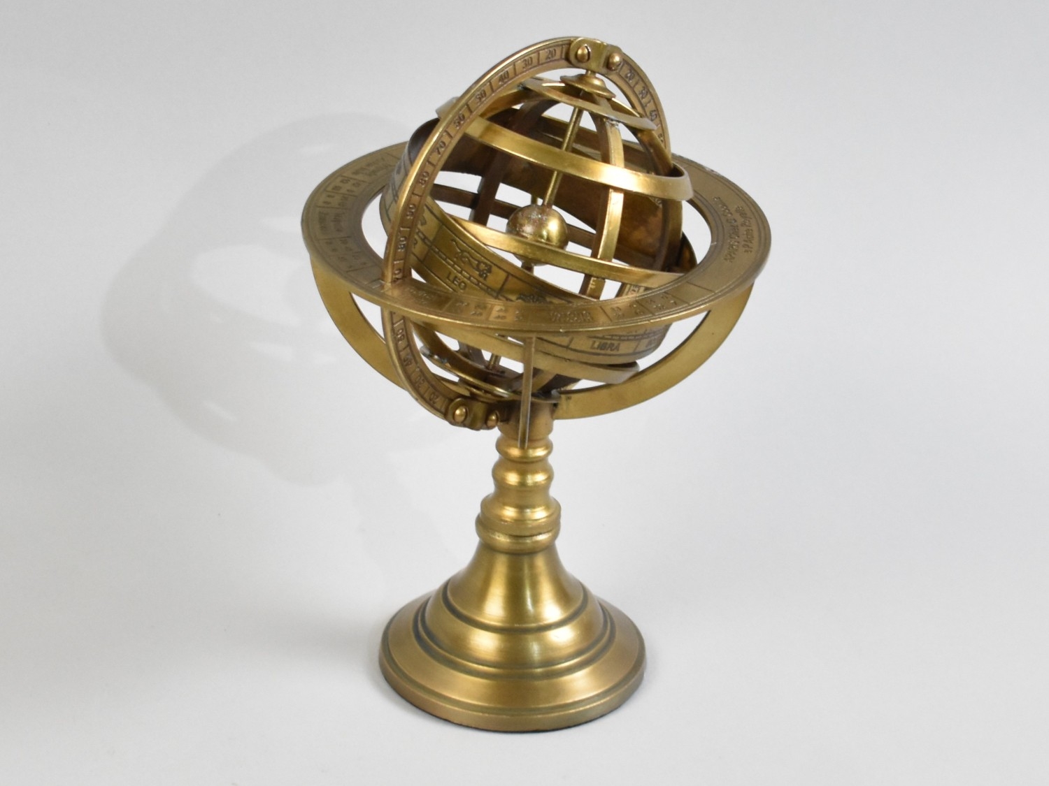 A Reproduction Desktop Brass Armillary Sphere, 21cms High