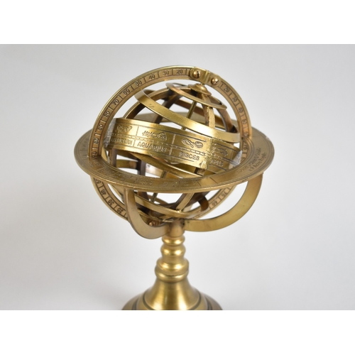 A Reproduction Desktop Brass Armillary Sphere, 21cms High