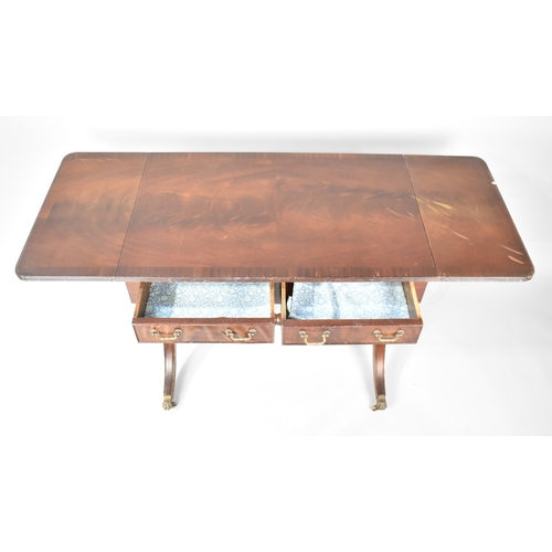 32 - A Late 20th Century Mahogany Drop Leaf Sofa Style two Drawer Table with Lyre Supports, Condition Iss... 