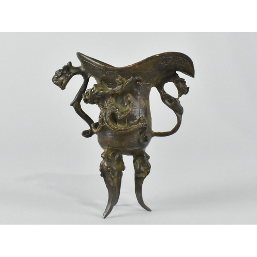 16 - A Chinese Bronze Model of a Libation Cup or Jue, Archaic Form, 9cms High