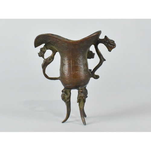 16 - A Chinese Bronze Model of a Libation Cup or Jue, Archaic Form, 9cms High