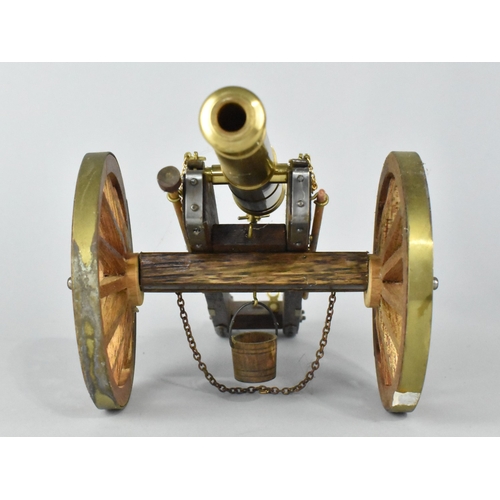 23 - A Brass and Wooden Model of a Napoleonic Field Cannon, 30cms Long