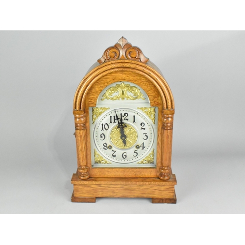 29 - An Oak Cased American Mantel Clock, The Rialto by Ansonia Clock Company, with Key and Pendulum, 41cm... 