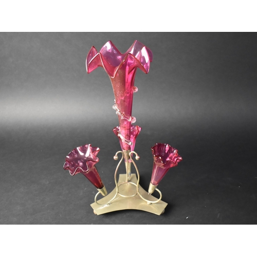 30 - A Late Victorian/Edwardian Silver Plate and Cranberry Glass Three Trumpet Epergne, 37cms High