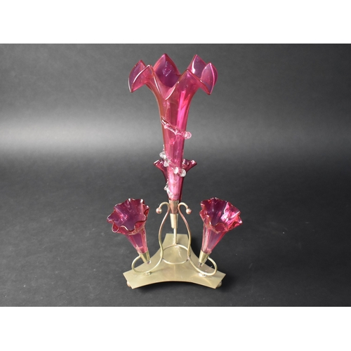 30 - A Late Victorian/Edwardian Silver Plate and Cranberry Glass Three Trumpet Epergne, 37cms High