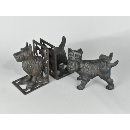 128 - A Cast Iron Door Stop in the Form of a Terrier with Cocked Leg together with a Pair of Bookends Deco... 