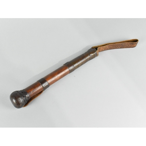 2 - A Turned Wooden Priest/Truncheon with Leather Button Hanger and Wrist Band, Overall Length 40cms