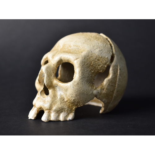 30 - A Cold Painted Cast Metal Novelty Candle Holder in the Form of a Small Human Skull, 7.5cms High