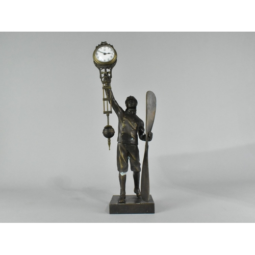 32 - A Reproduction Patinated Bronze Novelty Figural Mystery Clock in the Form of a WWI Pilot with Propel... 