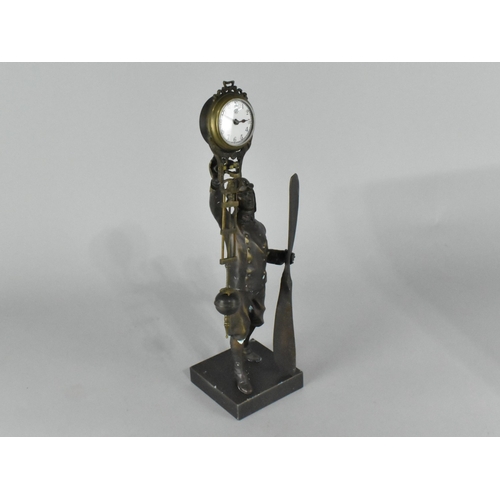 32 - A Reproduction Patinated Bronze Novelty Figural Mystery Clock in the Form of a WWI Pilot with Propel... 