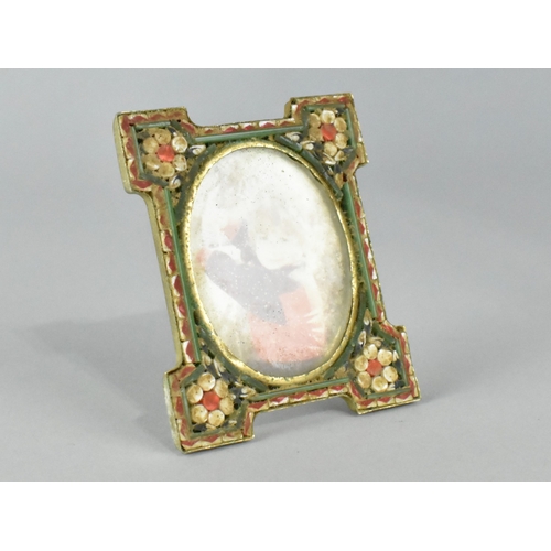 37 - A Small Enamelled Easel Back Photo Frame with Floral Decoration, 5.25cms Wide and 6.5cms High