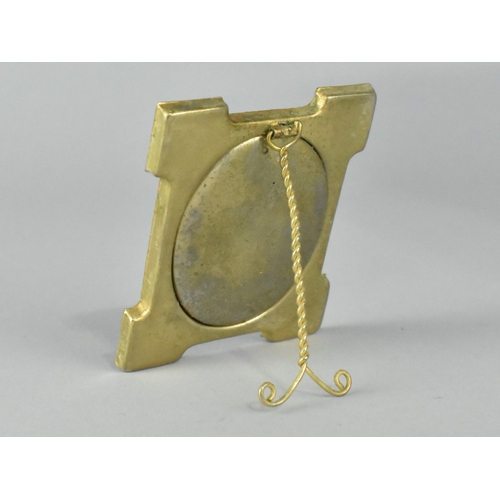 37 - A Small Enamelled Easel Back Photo Frame with Floral Decoration, 5.25cms Wide and 6.5cms High