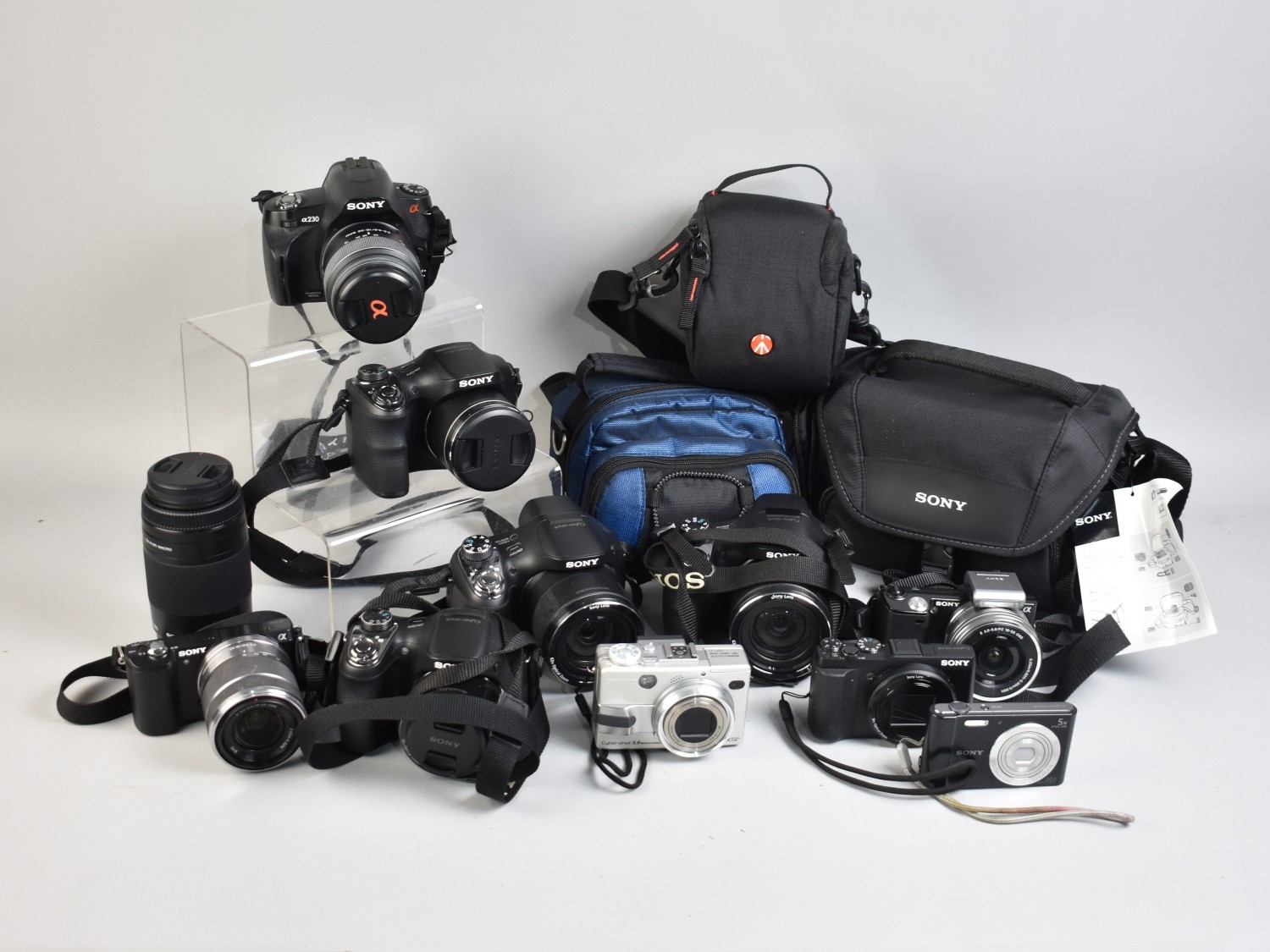 A Box Containing Large Quantity of Sony Digital Cameras, Lenses Etc