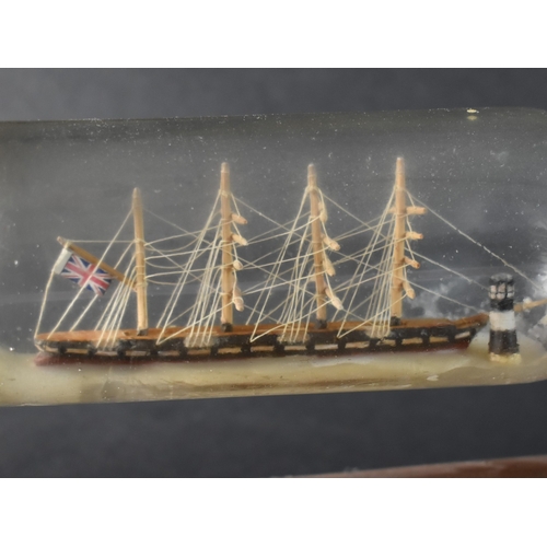 60 - A Mid 20th Century Ship in a Bottle Mounted on Wooden Stand, 28cms Wide