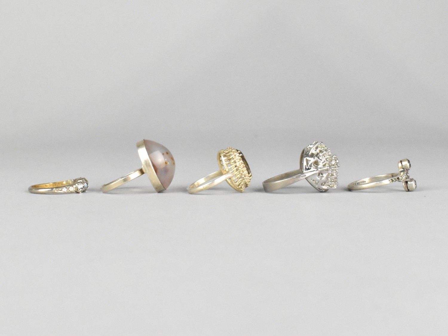 A Collection of Five White Metal Mounted Rings to include Agate, Smokey ...