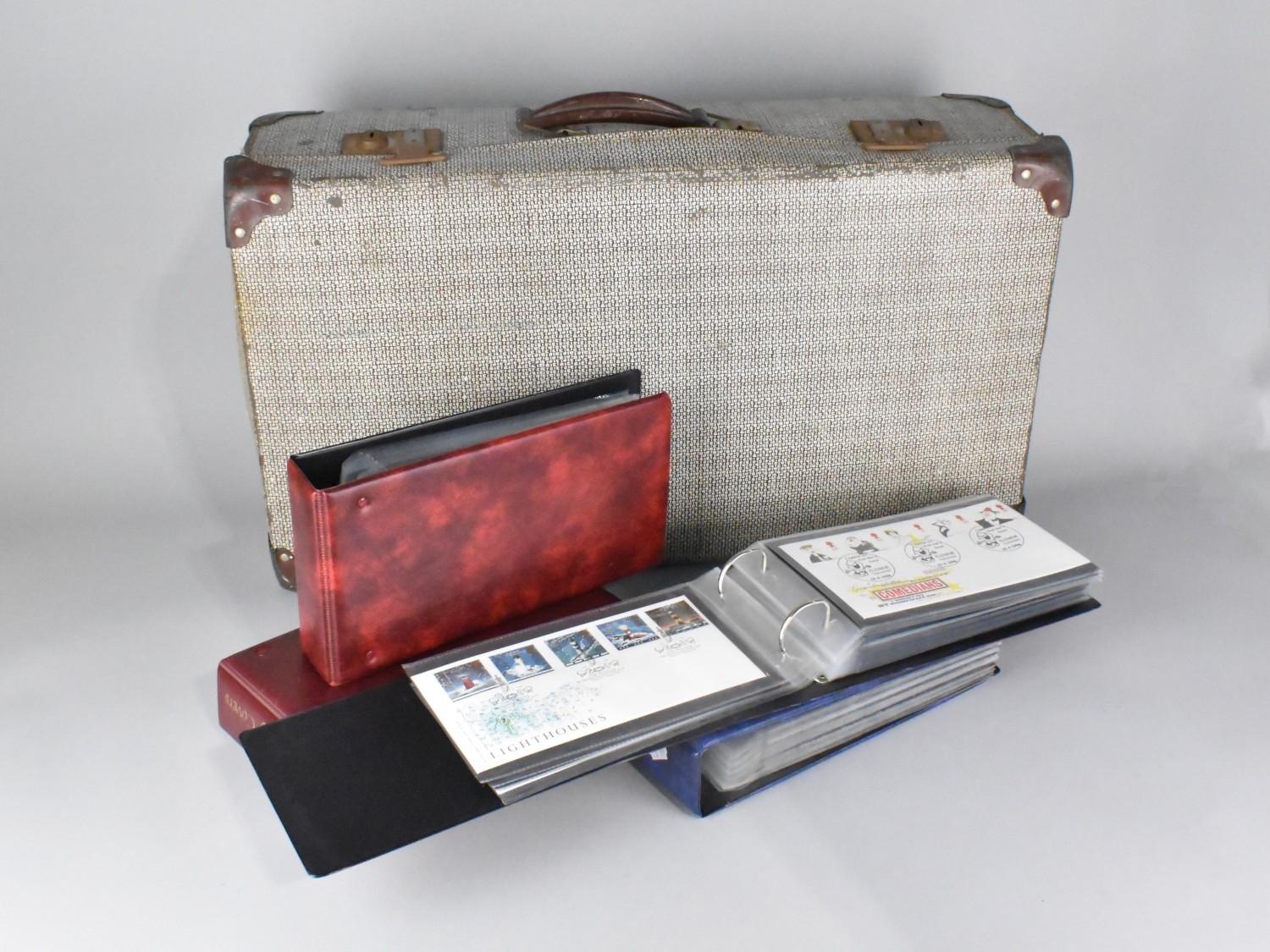 A Vintage Suitcase Containing Four Ring Binders of First Day Covers