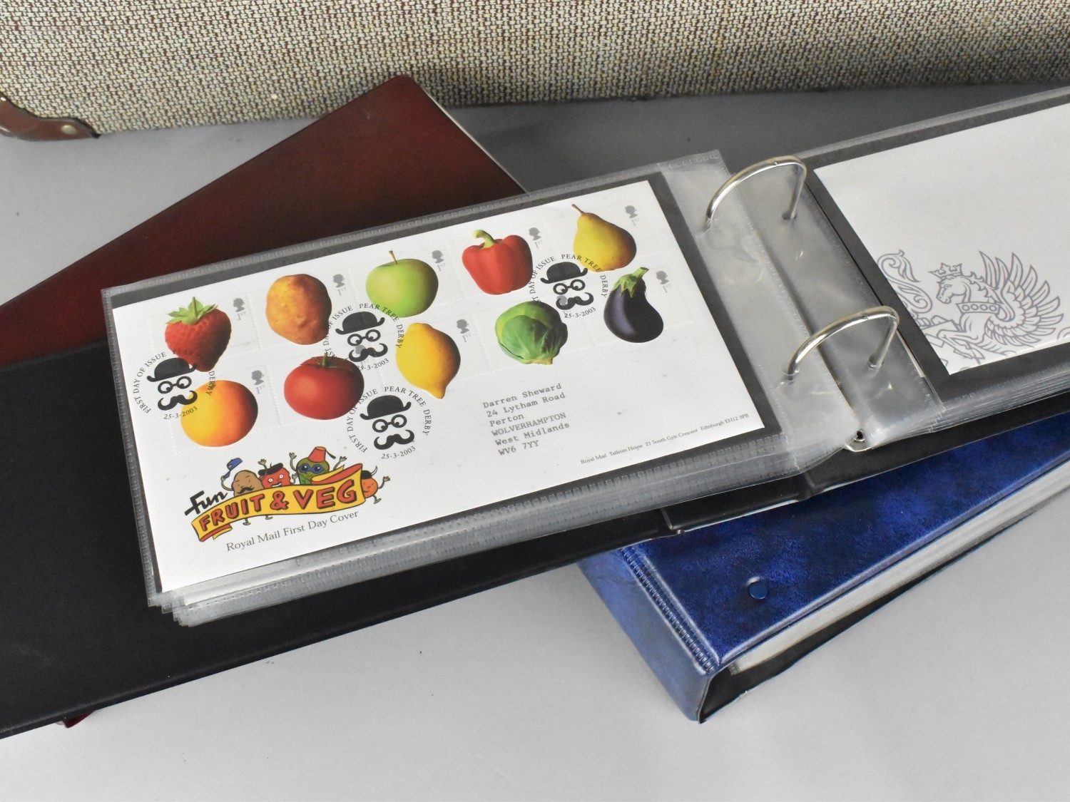 A Vintage Suitcase Containing Four Ring Binders of First Day Covers