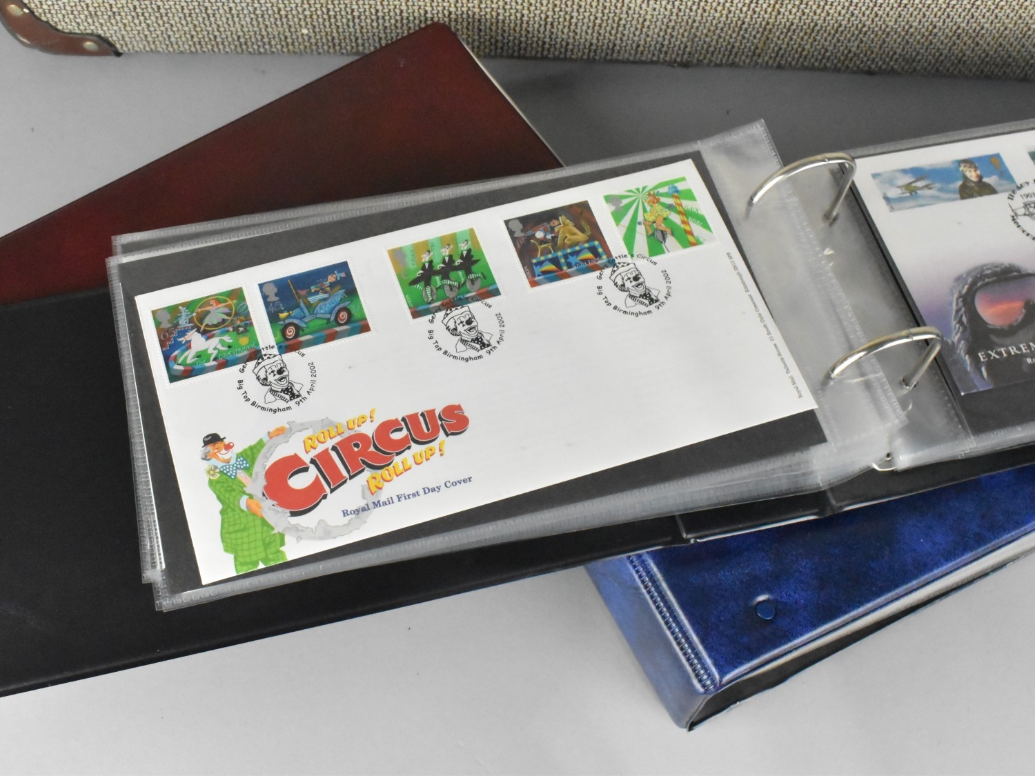A Vintage Suitcase Containing Four Ring Binders of First Day Covers