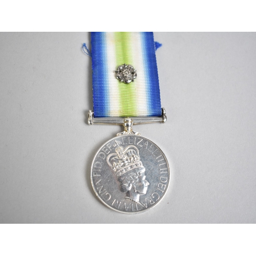 A Falklands War South Atlantic Medal Awarded to Private G Wilson 2453150 2 Para (Who Served 1979-1985), The Ribbon With Rosette and together with his Cap Badge and Cloth Badge. PLEASE NOTE. Following an observation on the authenticity of this lot especially with regard to the engraving of "2 PARA" the vendor is granting a 14 day Verification Period to enable the purchaser to assure themselves as to the authenticity of this lot.
