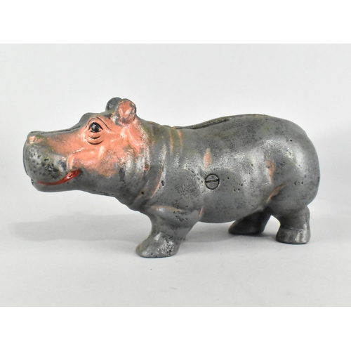 51 - A Cold Painted Cast Iron Novelty Money Bank In The Form Of A Hippo, 20cms Long