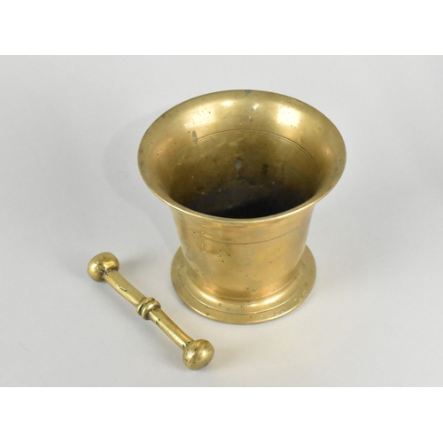 55 - A Polished Bronze Mortar, 12cms Diameter and 10cms High with a Brass Pestle,11cms Long